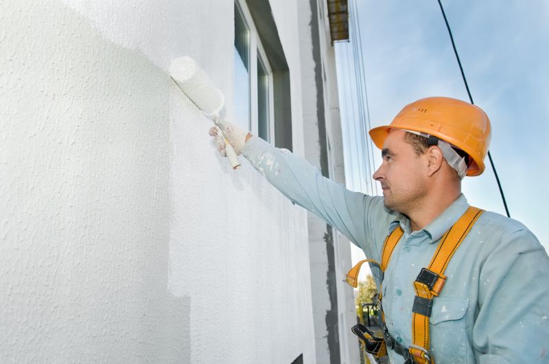 Handyman Painting a Wall